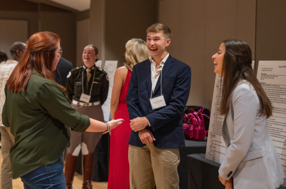 Students talk with company representatives at the POSC Reverse Career Fair on Thursday, Nov 14, 2024 in College Station, Texas by Hannah Harrison, Texas A&M AgriLife